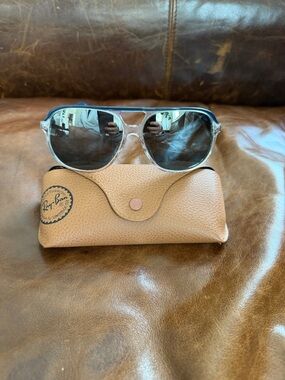 Ray-Ban Transparent Frame Sunglasses with Dark Gray Lenses and Black Temples